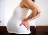 کمر درد دوران بارداري علت و درمان
