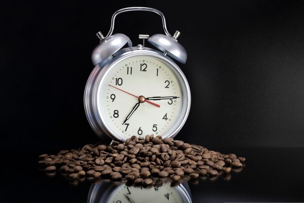 scattered-coffee-beans-classic-alarm-clock-morning-coffee-day-start-concept-advertising-time-drink-coffee_331695-1957.jpg