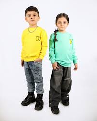 فرآیند طراحی و تولید پوشاک بچه‌گانه، از طراحی اولیه تا تولید دستی و صنعتی